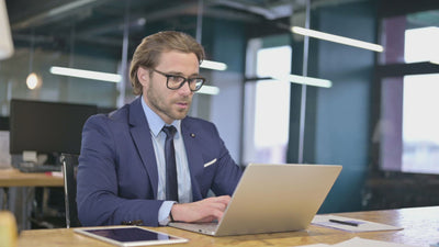 reachXOD - Organizational Restructuring - Business man working in office on restructuring plan