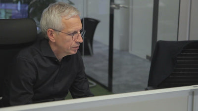 reachXOD - Curbing your technology costs -  Business man working at office desk